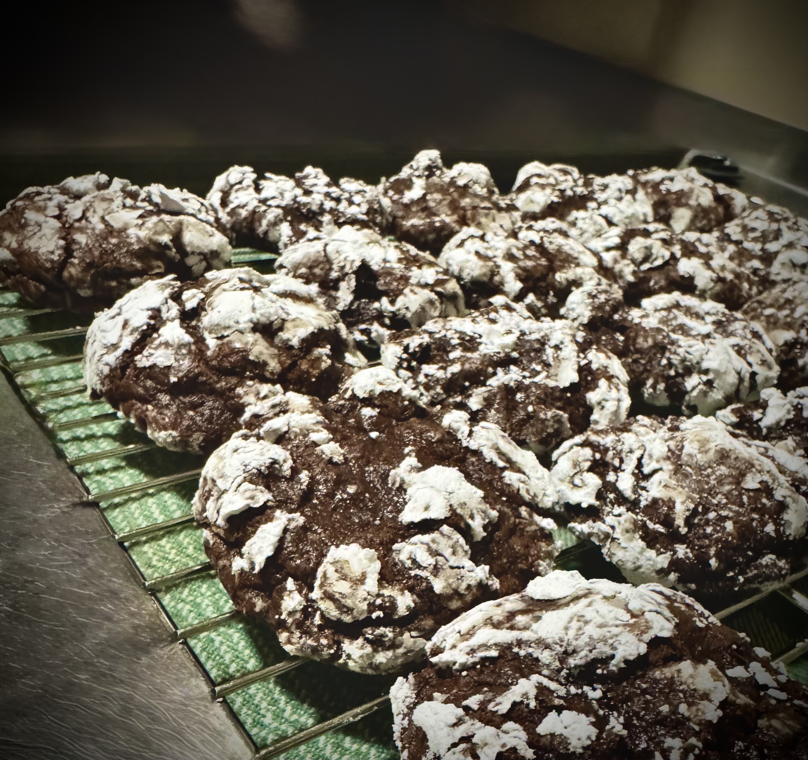 Chocolate crackle cookies with powdered sugar tops